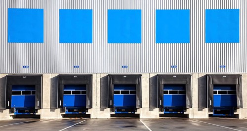5 blue loading ramps at warehouse