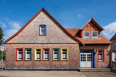 Restored clapboard house made of wooden shingles