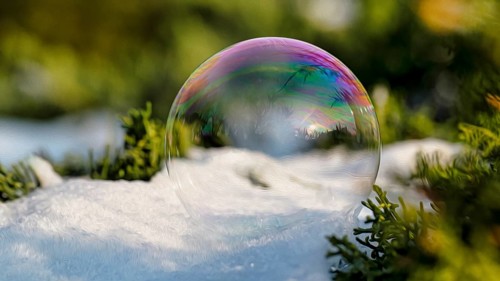 Freezing soap bubble on snow