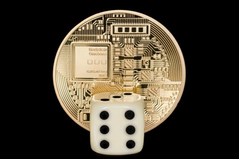 A dice in front of a coin