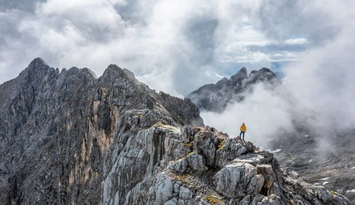 Hiker at the summit of the Westliche Toerlspitze