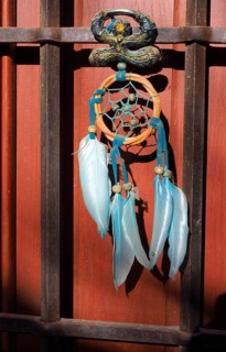 Andalusian lucky charm Indalo and dream catcher on front door