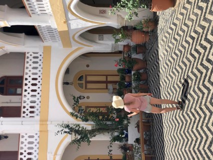 Tourist standing in a courtyard