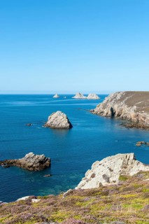 Rock islands in front of rocky coast