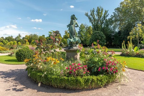 Statue of Lison with geese in the park of the orangery in Strasbourg