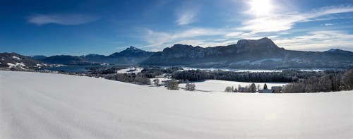 View of snow-covered Mondseeland with Schafberg and Drachenwand