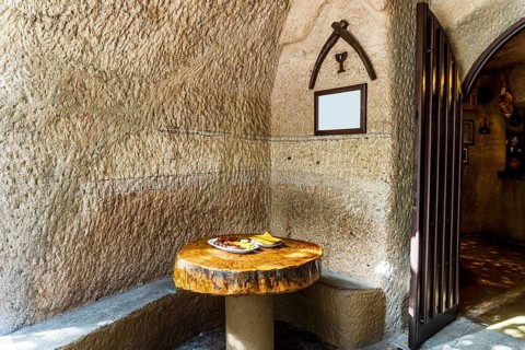 Mixed meat barbecued and served with french fries in restaurant in the cave