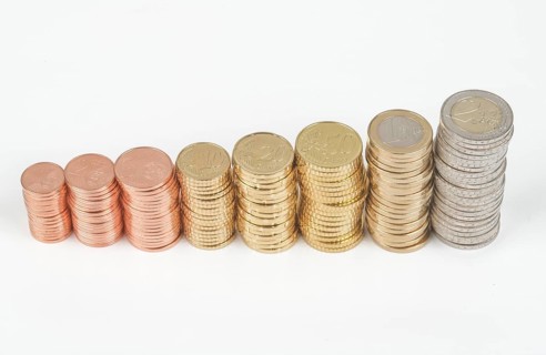 Stack of cent coins and euro coins