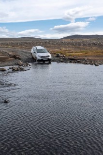 Dacia Duster 4x4 car crossing a river