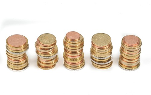 Stack of cent coins and euro coins