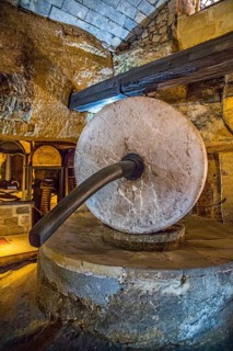 Underground oil mill with millstones