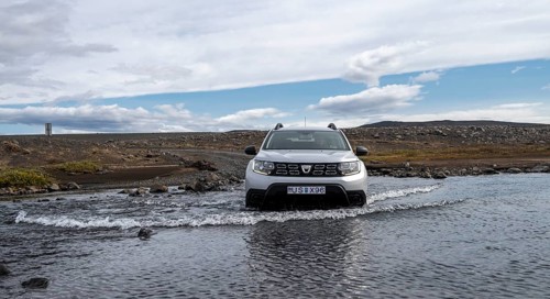 Dacia Duster 4x4 car crossing a river