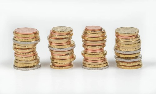 Stack of cent coins and euro coins