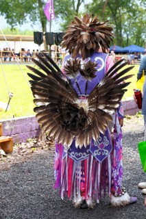 Indian with colorful dress at a Pow Wow