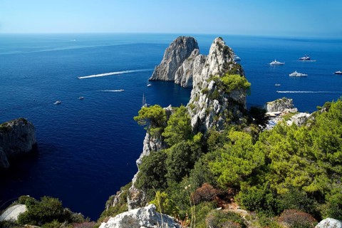 Rocky coast with boats on the sea