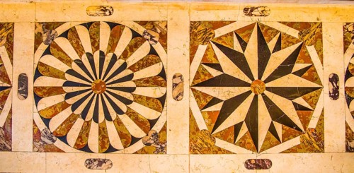 The altar and floor impress with beautiful marble inlay work showing Christian motifs