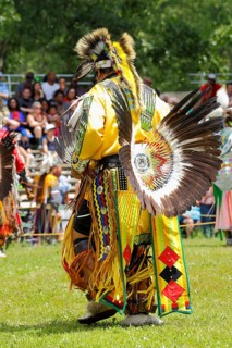 Indian with colorful dress at a Pow Wow