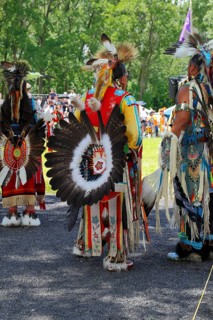 Native Americans with colorful dress at a Pow Wow