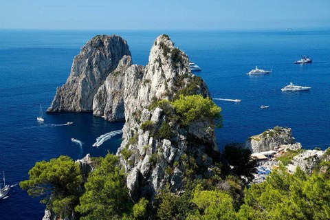 Rocky coast with boats on the sea