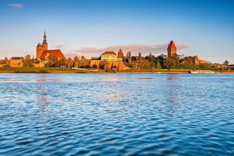 View over the Elbe to the old town with St. Stephan's Church in the morning light