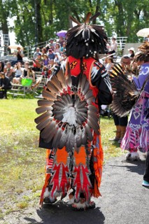 Indian with colorful dress at a Pow Wow