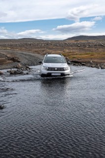 Dacia Duster 4x4 car crossing a river
