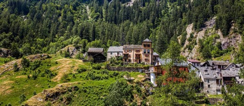 Characteristic old buildings in stone and wood in the village of Fusio