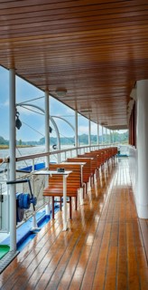 Wood-panelled outside deck of an excursion boat