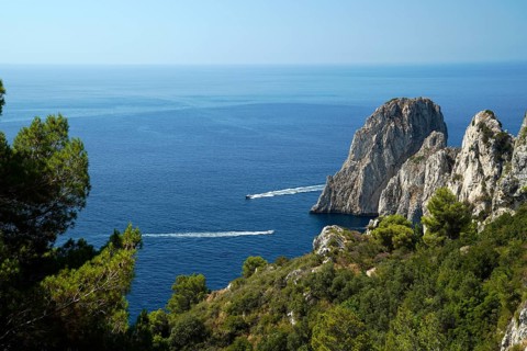 Rocky coast with boats on the sea