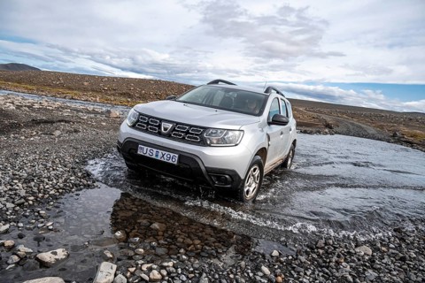 Dacia Duster 4x4 car crossing a river