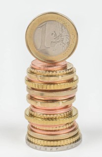 Stack of cent coins and euro coins