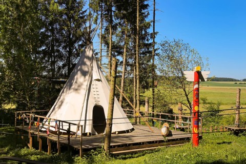 Indian tent in the forest ropes course