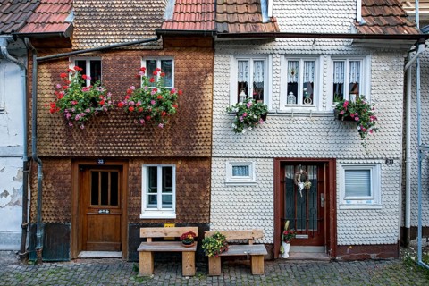 Historic shingle houses decorated with flowers