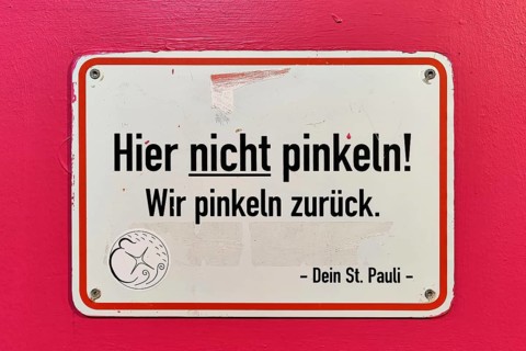 Sign No peeing here. We pee back. Your St. Pauli