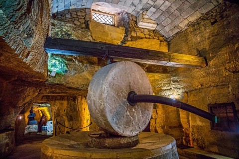 Underground oil mill with millstones