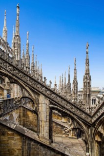 Stone carving on the roof of Milan Cathedral in white marble
