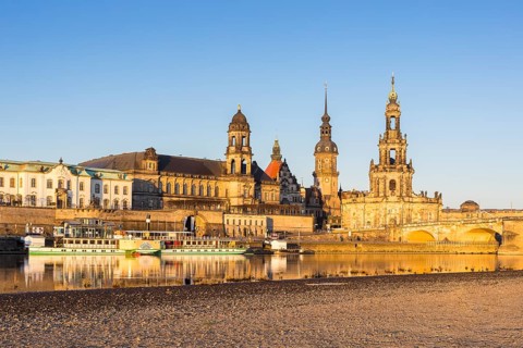 City view in the morning light with reflection in the river Elbe