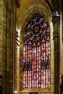 14th century Milan Cathedral stained glass windows in white marble