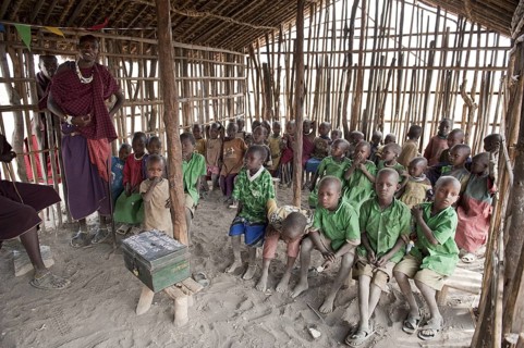 Children in a primary school class with a teacher, Masai, village of Kiloki