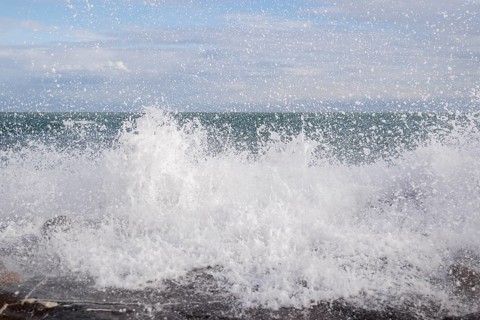 Strong swells during storm break on seawall in Sanremo