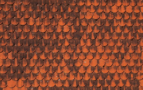Detail of a red old tiled roof