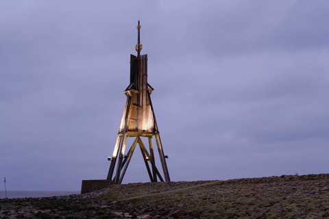 Illuminated Kugelbake at blue hour