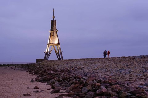 Illuminated Kugelbake at blue hour
