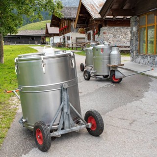 Milk tanks waiting to be emptied in front of the Eng-Alm cheese dairy