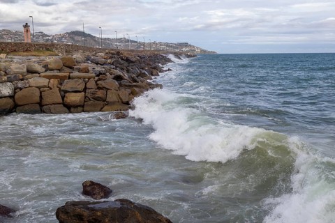 Strong swells during storm break on seawall in Sanremo