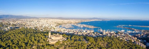 Castell de Bellver castle with harbour holiday travel aerial panorama in Palma de Majorca