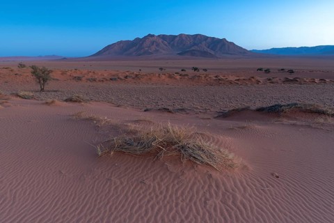 The foothills of the Namib Desert with Losberg Mountain in the background in front of sunrise