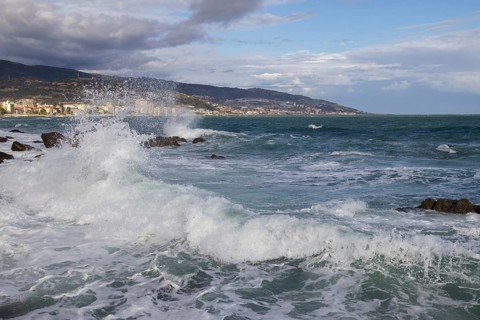 Strong swells during storm break on seawall in Sanremo