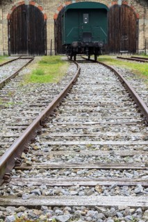 Railway line with an old railway carriage