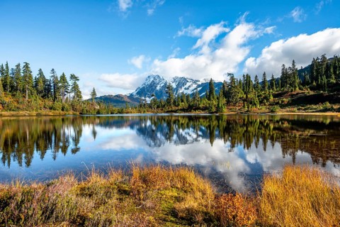Mt. Shuksan glacier with snow reflecting in Picture Lake